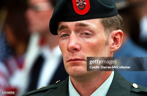 Special forces soldier grieves during a funeral for Army Staff Sgt. Christopher Piper June 27, 2005 in Marblehead, Massachusetts. Piper, a special...