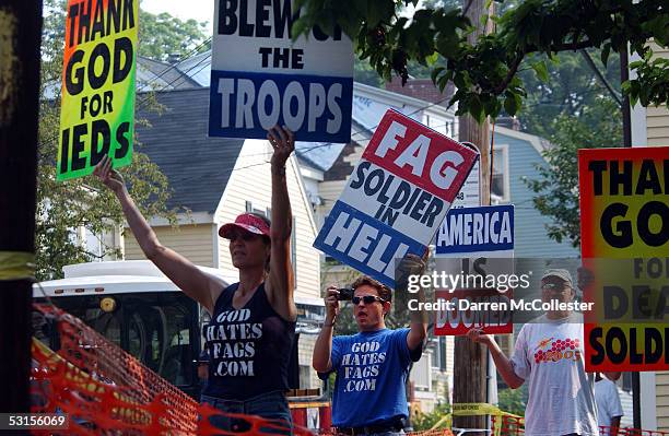 Members of the Westboro Baptist Church in Kansas hold signs June 27, 2005 while protesting during a funeral for Staff Sgt. Christopher Piper in...