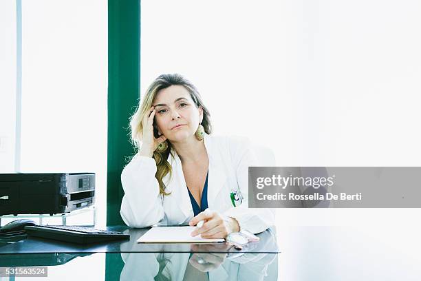 female doctor at office - banging your head against a wall stock pictures, royalty-free photos & images