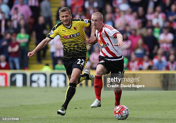 Tom Robson of Sunderland and Almen Abdi of Watford compete for the ball during the Barclays Premier League match between Watford and Sunderland at...
