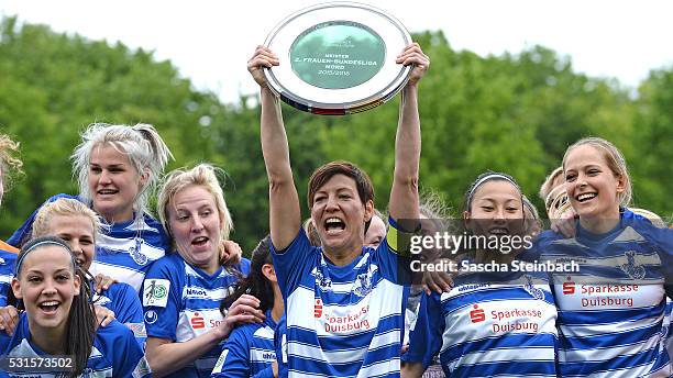 Captain Linda Bresonik of Duisburg lifts the trophy after winning the 2. Frauen Bundesliga Nord championship at PCC-Stadion on May 15, 2016 in...