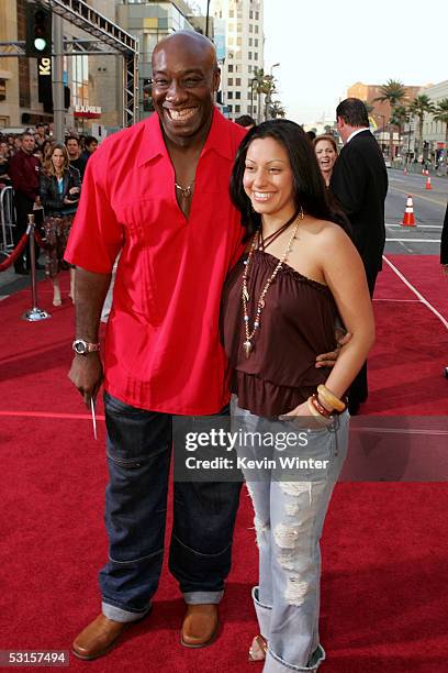 Actor Michael Clarke Duncan and Irene Marquez arrive at the Los Angeles fan screening of "War of the Worlds" at the Grauman's Chinese Theatre on June...
