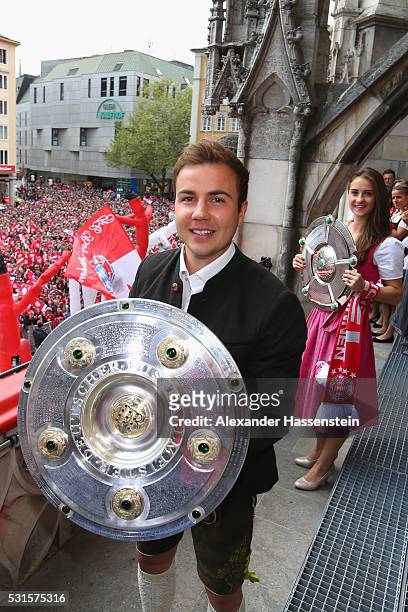 Mario Goetze of Bayern Muenchen celebrate winning the German Championship title on the town hall balcony at Marienplatz on May 15, 2016 in Munich,...