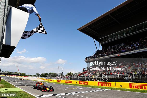 Max Verstappen of the Netherlands driving the Red Bull Racing Red Bull-TAG Heuer RB12 TAG Heuer takes the chequered flag for his first F1 win during...
