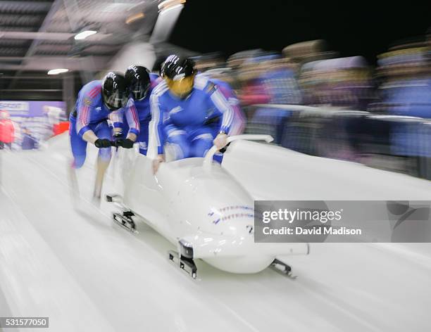 Alexander Zubkov of Russia and his teammates leap into their four man bobsled at the start of the four man race of the FIBT World Cup on February 7,...