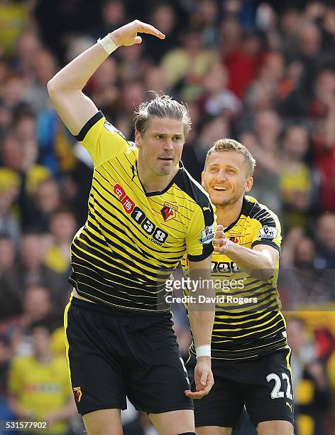 Sebastian Prodl of Watford celebrates scoring his team's first goal with his team mate Almen Abdi during the Barclays Premier League match between...
