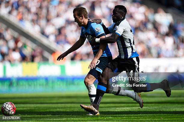 Harry Kane of Tottenham Hotspur is challenged by Cheik Ismael Tiote of Newcastle United during the Barclays Premier League match between Newcastle...