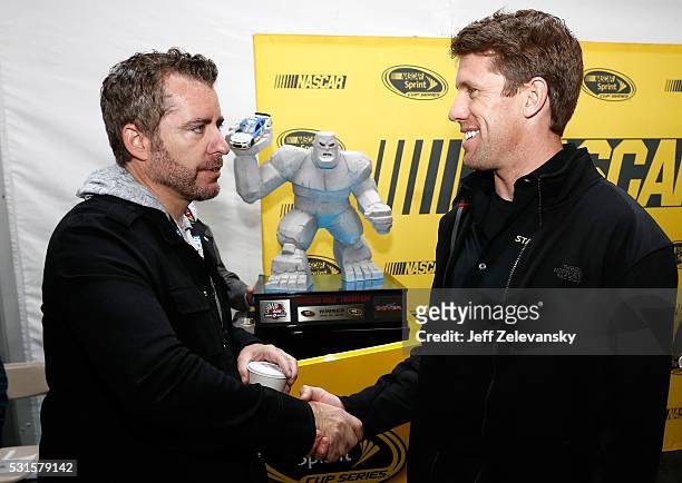 Actor and comedian, Jason Jones, meets Carl Edwards, driver of the Stanley Toyota, before the NASCAR Sprint Cup Series AAA 400 Drive for Autism at...