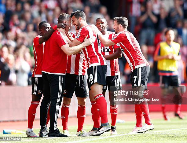 Graziano Pelle of Southampton celebrates scoring his team's second goal with his team mates and coaches during the Barclays Premier League match...