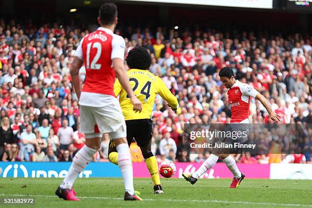 Mikel Arteta of Arsenal shoots at goal resulting in their team's fourth goal scored own goal by Mark Bunn of Aston Villa during the Barclays Premier...