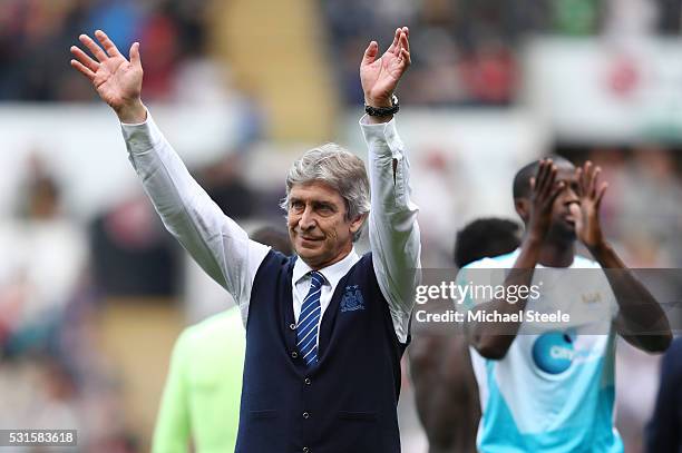 Manuel Pellegrini, manager of Manchester City waves to fans after the Barclays Premier League match between Swansea City and Manchester City at the...