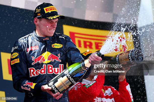 Max Verstappen of Netherlands and Red Bull Racing sprays the champagne on the podium after his first F1 win during the Spanish Formula One Grand Prix...