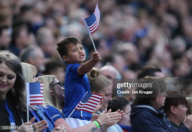 Everton supporters wave national flags of the United States as Tim Howard of Everton applauding crowds after the Barclays Premier League match...