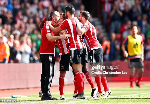 Graziano Pelle of Southampton celebrates scoring his team's second goal with his team mates and coaches during the Barclays Premier League match...