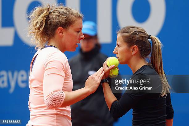 Annika Beck and Anna-Lena Friedsam of Germany talk during their match against Katharina Hobgarski and Carina Witthoeft of Germany during Day Two of...