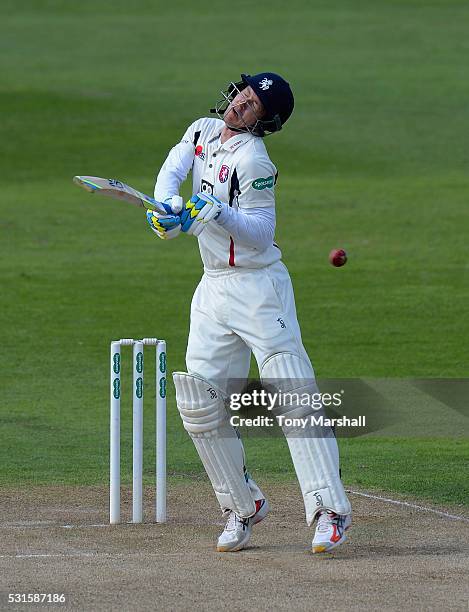 Joe Denly of Kent is struck by a delivery from Olly Stone of Northamptonshire during day one of the Specsavers County Championship Division Two match...