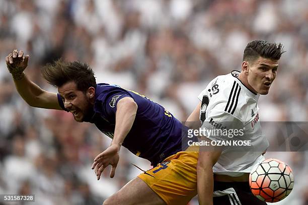 Besiktas' German forward Mario Gomez fights for the ball with Osmanli's Polish centre back Lukasz Szukala during the Turkish Spor Toto Super league...