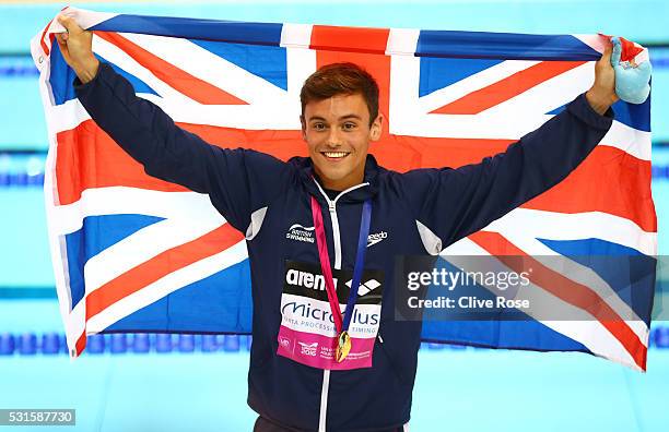 Tom Daley of Great Britain poses after receiving his gold medal for winning the Men's 10m Platform Final on day seven of the 33rd LEN European...