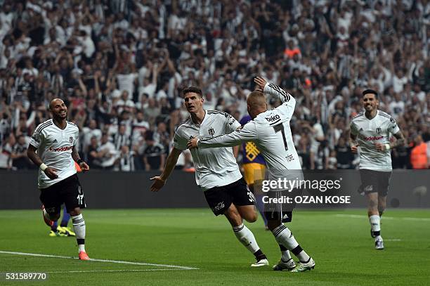 Besiktas's German forward Mario Gomez celebrates with his team mates after scoring a goal during the Turkish Spor Toto Super league football match...