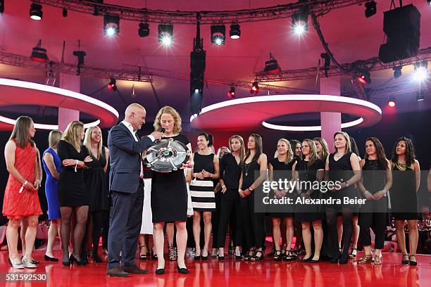 Bayern Muenchen player Melanie Behringer is interviewd by speaker Stefan Lehmann during the FC Bayern Muenchen Bundesliga Champions Dinner at the...