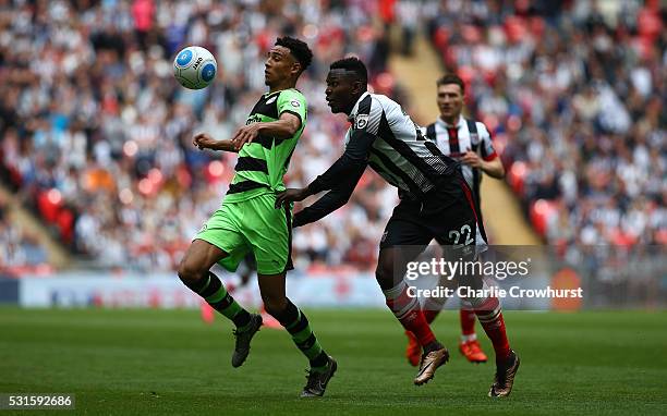 Forest Green's Kurtis Gutrie looks to hold off Grimsby's Aristote Nsiala during the Vanarama Football Conference League Play Off Final between Forest...