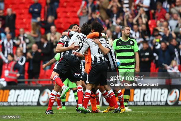 Grimsby's players celebrate the teams win and promotion at the final whistle during the Vanarama Football Conference League Play Off Final between...