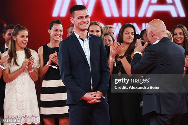 Team coach Thomas Woerle of the FC Bayern Muenchen women team is interviewed by speaker Stefan Lehmann during the Bundesliga Champions Dinner at the...