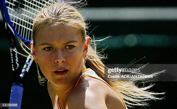 United Kingdom: Maria Sharapova of Russia lines up a forehand to Nadia Petrova of Russia during their quarter final match at the 119th Wimbledon...