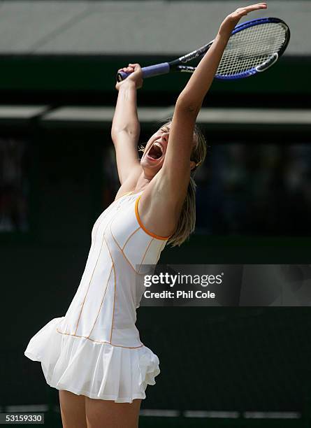 Maria Sharapova of Russia celebrates winning at match point against Nadia Petrova of Russia during the eighth day of the Wimbledon Lawn Tennis...