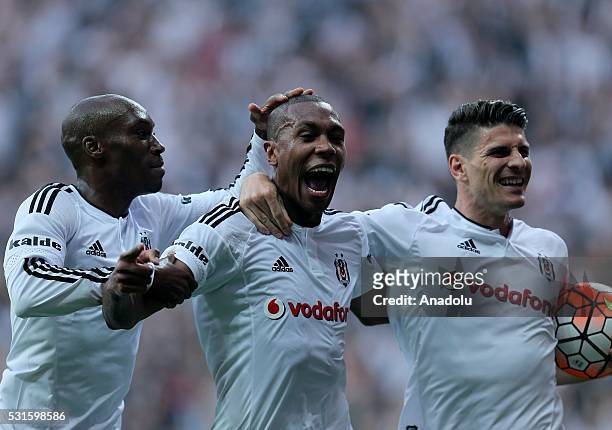 Marcelo of Besiktas celebrates his score with his team mates Atiba Hutchinson and Mario Gomez during the Turkish Spor Toto Super Lig soccer match...