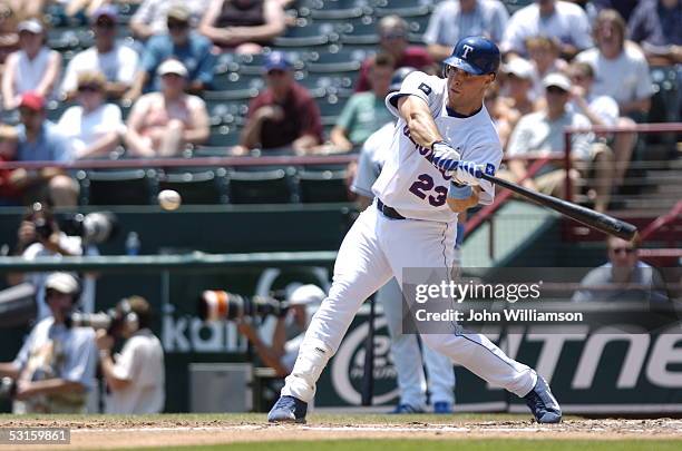 First baseman Mark Teixeira of the Texas Rangers bats during the game against the Washington Nationals at Ameriquest Field in Arlington on June 19,...