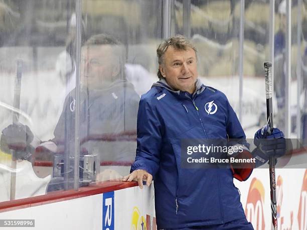 Associate coach Rick Bowness of the Tampa Bay Lightning helps conduct an off-day practice session prior to Game Two of the Eastern Conference Final...