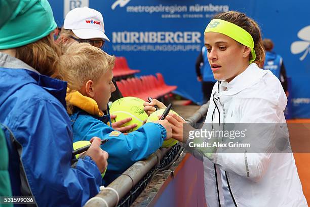 Nicole Gibbs of USA signs autographs after defeating Kristyna Pliskova oif Czech Republic during Day Two of the Nuernberger Versicherungscup 2016 on...