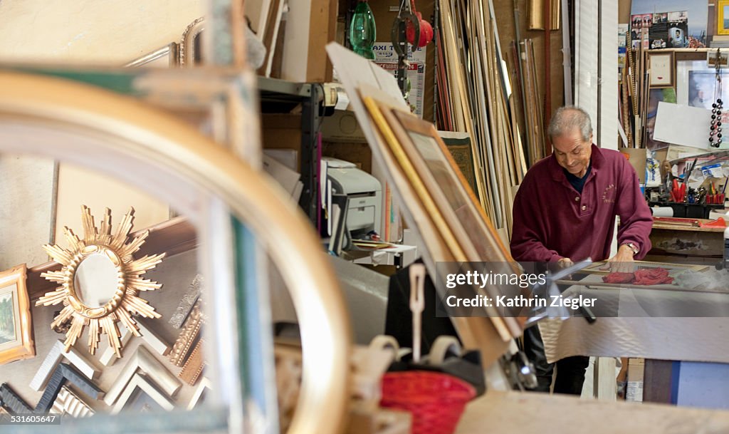 Craftsman working in a frame shop