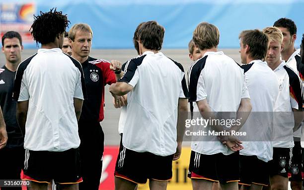 Juergen Klinsmann headcoach of Germany talks to Patrick Owomoyela, Sebastian Deisler, Tim Borowski, Bernd Schneider, Mike Hanke during the training...