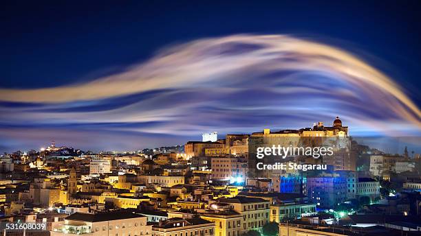 City skyline with smoke illuminated by lights