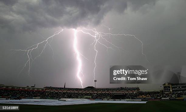 Lightning strikes as the players leave the field due to an electrical storm during the NatWest Series One Day International between England and...