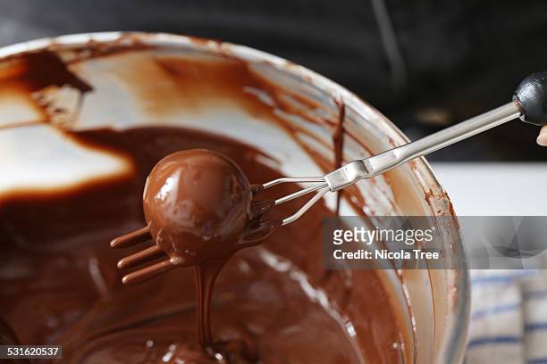 chocolate truffles being made - sweet shop stock pictures, royalty-free photos & images