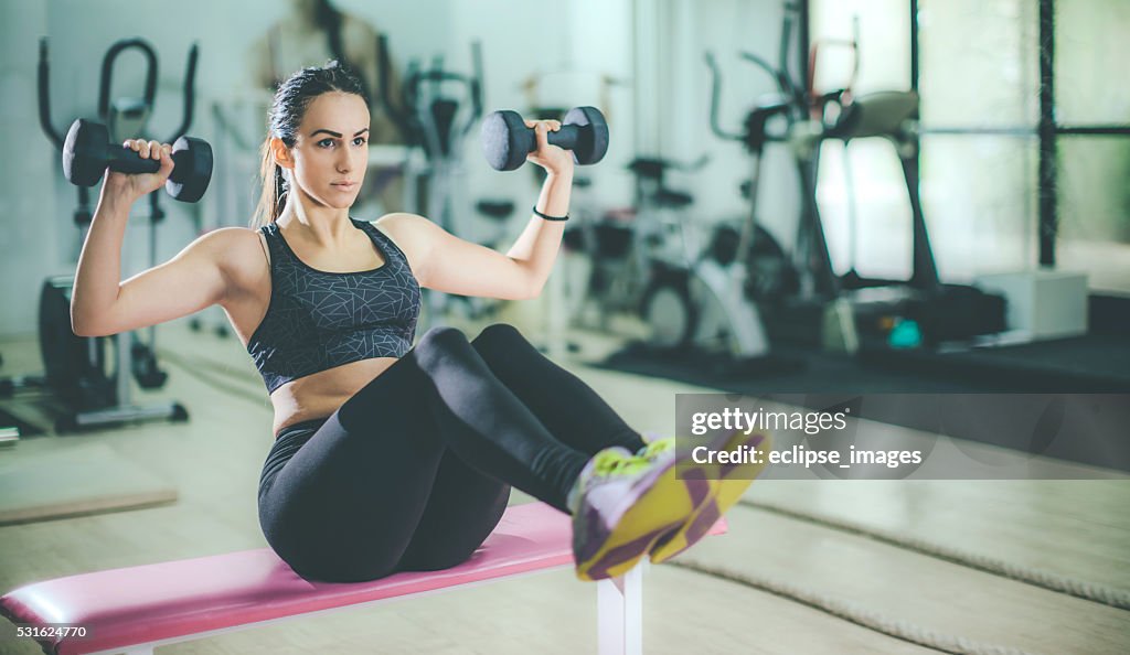 Young sporty woman exercise at the gym