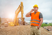 Construction worker takes a call