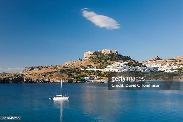 view across tranquil lindos bay, lindos, rhodes - rhodes,_new_south_wales stock pictures, royalty-free photos & images