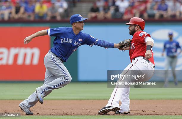 Darwin Barney of the Toronto Blue Jays makes the out against Mitch Moreland of the Texas Rangers in the second inning at Globe Life Park in Arlington...