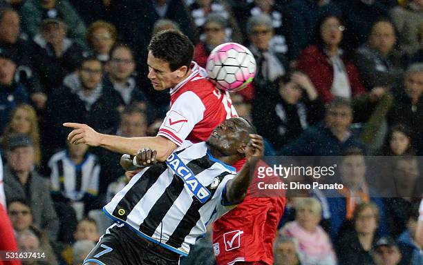 Emmanuel Agyemang Badu of Udinese Calcio competes with Kevin Lasagna of Carpi FC during the Serie A match between Udinese Calcio and Carpi FC at...