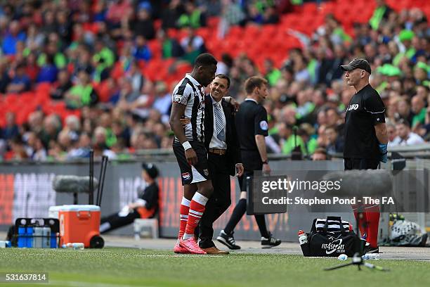 Manager Paul Hurst embraces Omar Bogle of Grimsby Town after substituting him during the Vanarama Football Conference League: Play Off Final match...