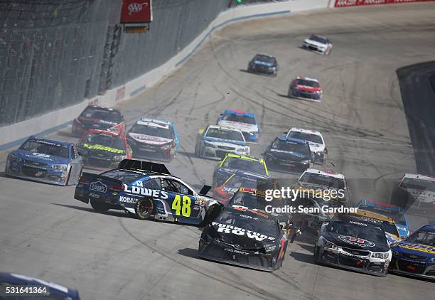 Jimmie Johnson, driver of the Lowe's Chevrolet, Ricky Stenhouse Jr, driver of the SunnyD Ford, and Martin Truex Jr, driver of the Furniture Row...