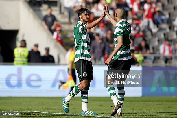 Sporting's Costa Rica forward Bryan Ruiz celebrates after scoring a goal with Sporting's Algerian forward Islam Slimani during the Premier League...