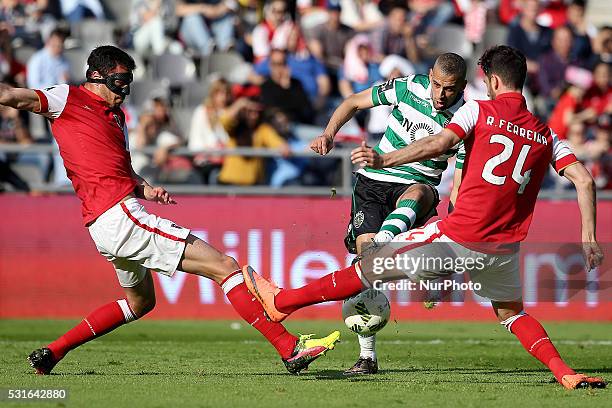 Sporting's Algerian forward Islam Slimani in action wit Braga's Portuguese defender Ricardo Ferreira during the Premier League 2015/16 match between...