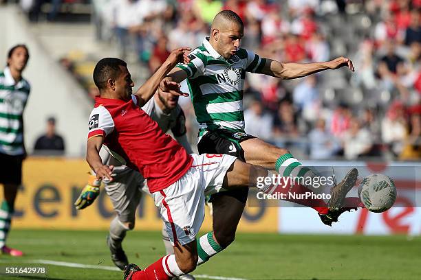 Sporting's Algerian forward Islam Slimani vies with Braga's Brazilian defender Marcelo Goiano during the Premier League 2015/16 match between SC...