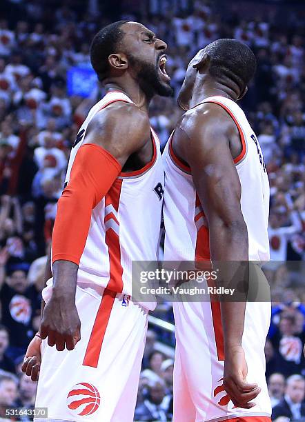 Patrick Patterson and Bismack Biyombo of the Toronto Raptors celebrate a basket in Game Seven of the Eastern Conference Quarterfinals against the...