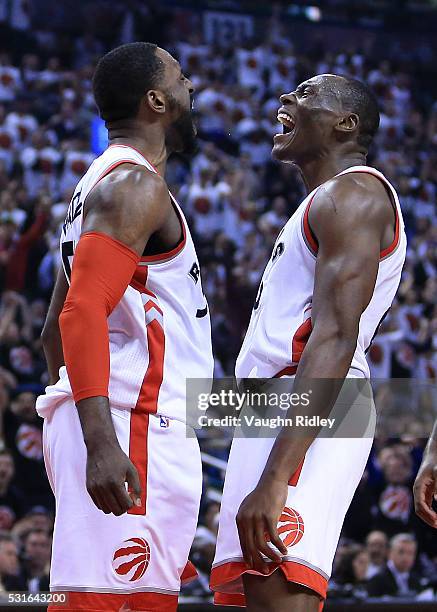 Patrick Patterson and Bismack Biyombo of the Toronto Raptors celebrate a basket in Game Seven of the Eastern Conference Quarterfinals against the...